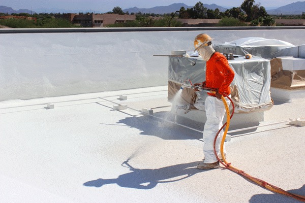 Roof coating being applied